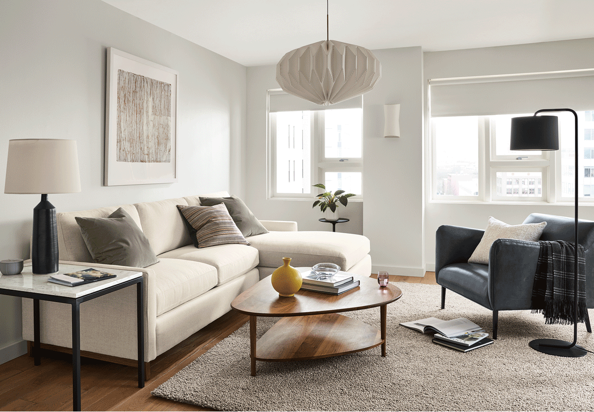 A living room with multiple lighting products turning off and on.