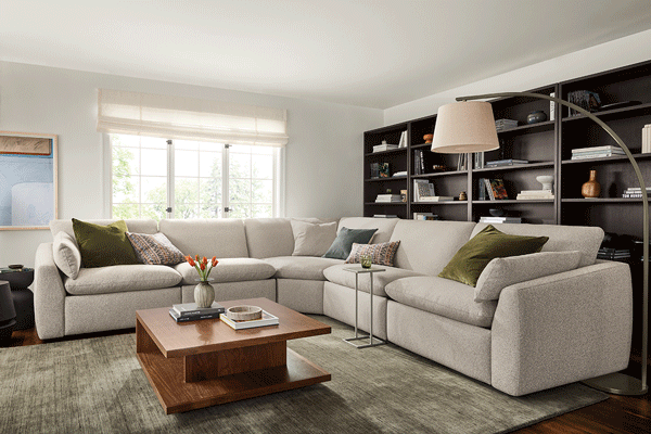 Weber sectional transitioning from upright seating to extended reclining positions with adjustable footrests.