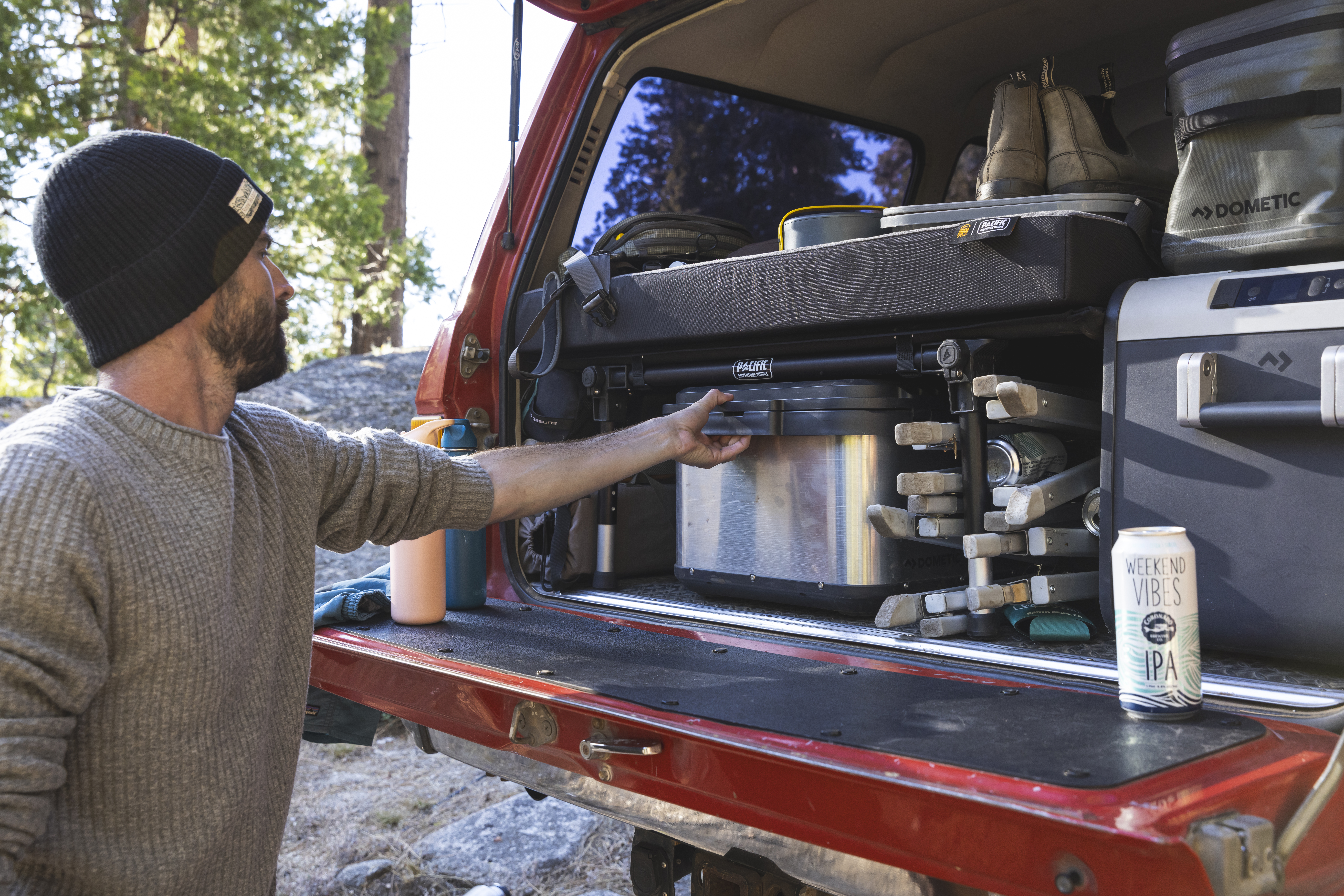 Image of a man unpacking his truck.