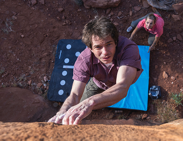 Photo of a man rockclimbing
