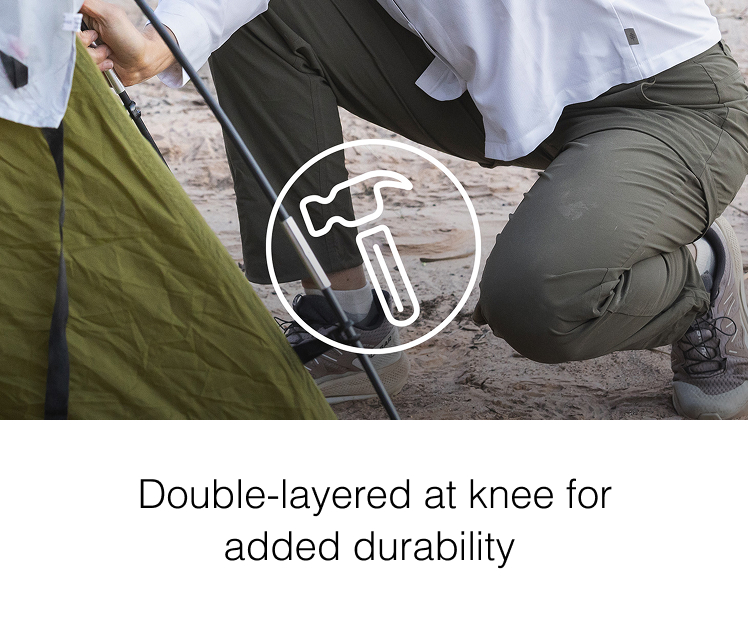 Woman kneeling down while setting up a tent, copy reads Double-layered at knee for added durability