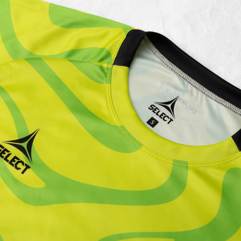 closeup of yellow jersey with green swirl pattern