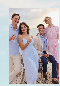 Image of two men and two women. Man in button down shirt and pants. Woman in blue dress. Man in blazer and pants. Woman in pink striped dress.