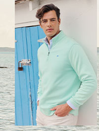 Man in light green quarter zip.
