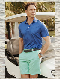 Man in blue polo and green shorts.