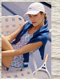 Woman in white ball cap and printed active dress.