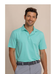 Man in green polo.