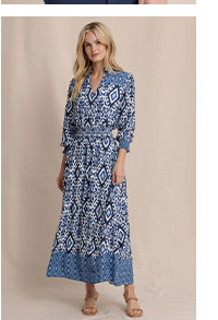 Woman in printed long sleeve maxi dress.