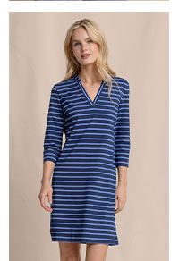 Woman in striped quarter sleeve mini dress.