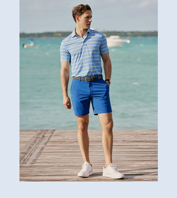 Rotating images of shorts in different colors laid down. Man in striped polo and blue shorts. Woman in striped button up and pink shorts.