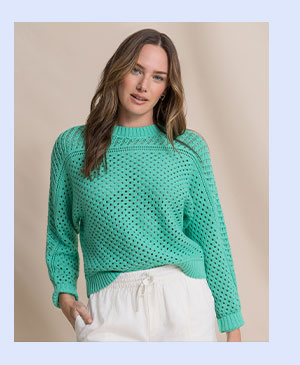Woman in green sweater.