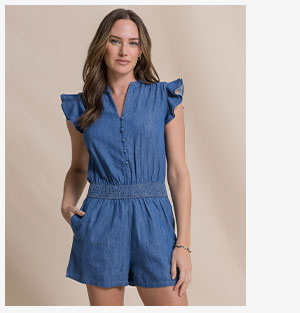 Woman in denim romper. 