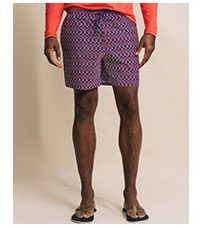 Man in blue and red patterned swim trunks.