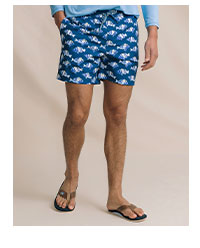 Man in blue fish patterned swim trunks.