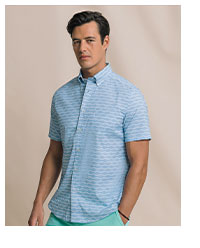 Man in blue patterned short sleeve sport shirt.