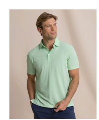 Man in green polo.