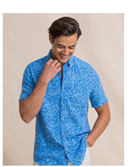Man in blue floral short sleeve sport shirt.
