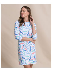 Woman in colorful patterned dress.