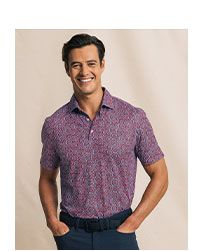 Man in red and blue fireword print polo.