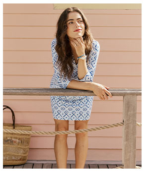 Woman in blue and white patterned dress. 