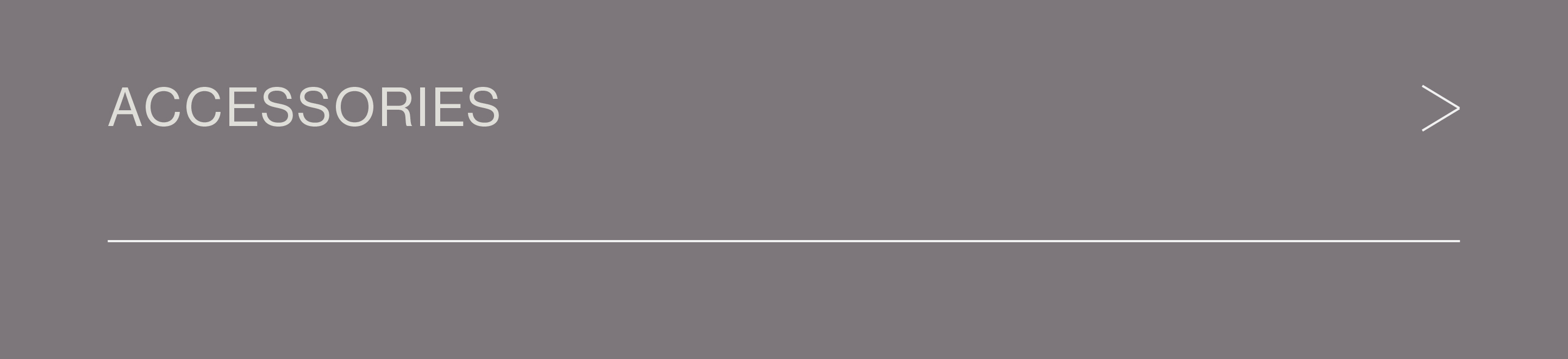 an image of a man in a suit and tie standing in front of a gray background