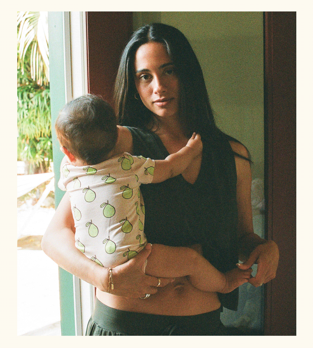 Model in Aria Thyme set holding baby
