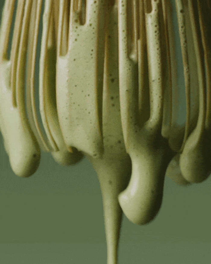 An image of a matcha whisk, whisking remnants of the Matcha Foam Cleanse from Tatcha.