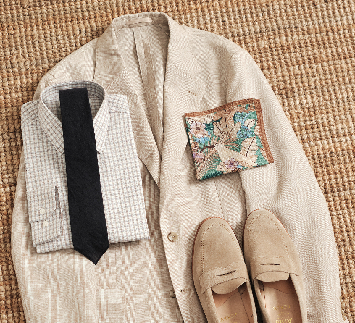 Lean into rich earth tones with a checked dress shirt, Italian-made pocket square, and our Navy French Linen Tie for texture that feels cohesive and refined.