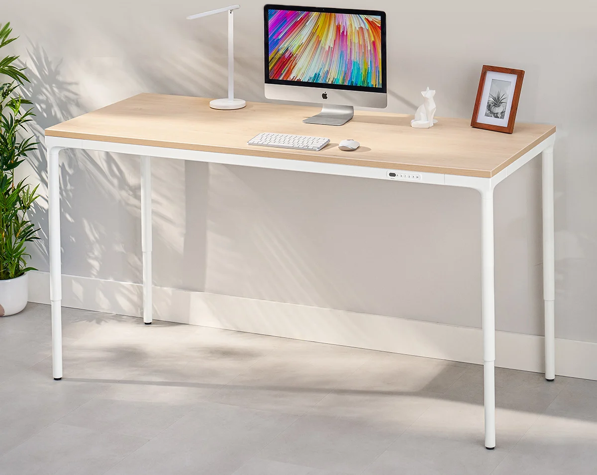 The Parsons standing desk in Maple finish with a white frame