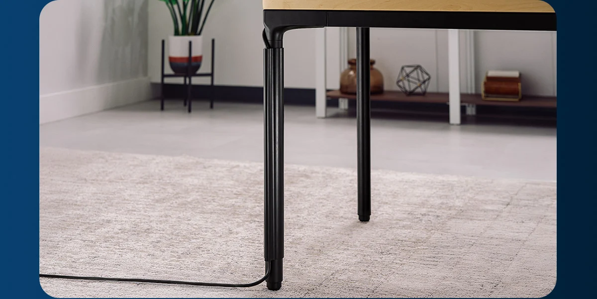 A Parsons Standing Desk leg hiding cables within for a clean, uncluttered look