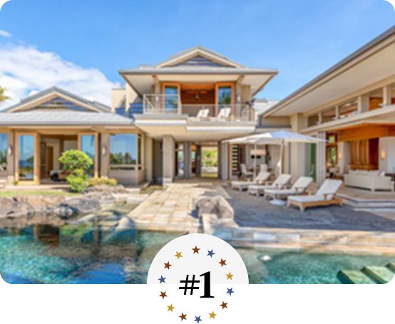 Luxury tropical villa with open-air design, poolside loungers, and scenic views.