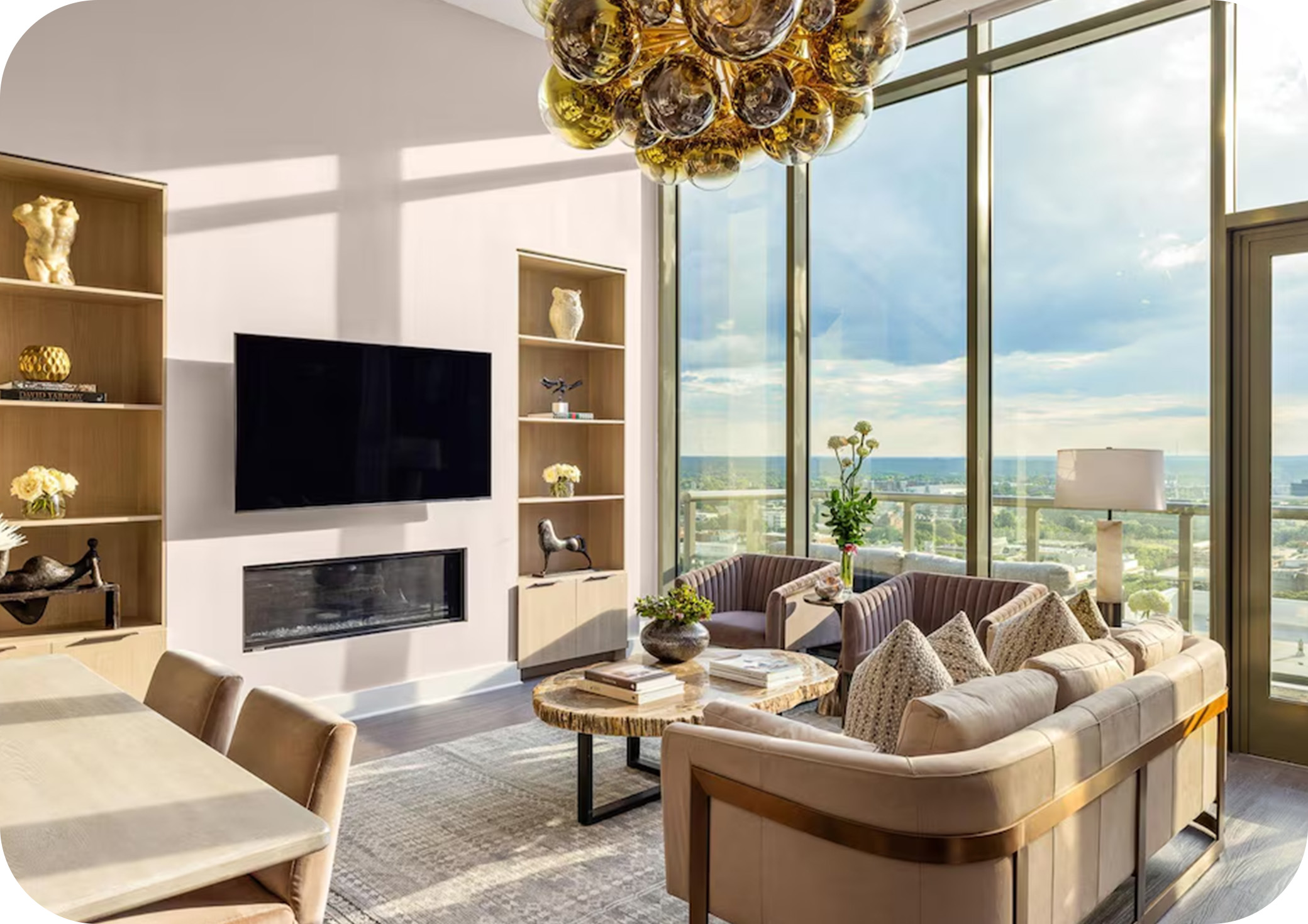 Sunlit modern living room with floor‑to‑ceiling windows and stylish neutral décor.