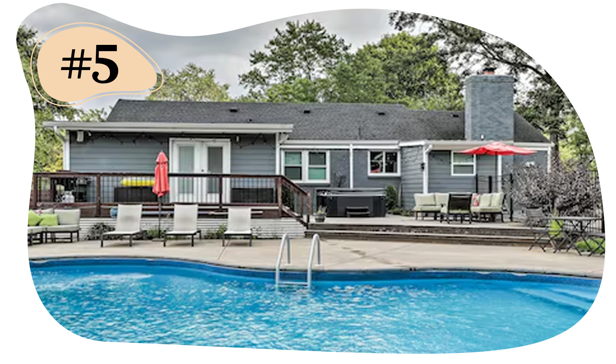 Single-story gray house with a deck, outdoor seating, and a pool.