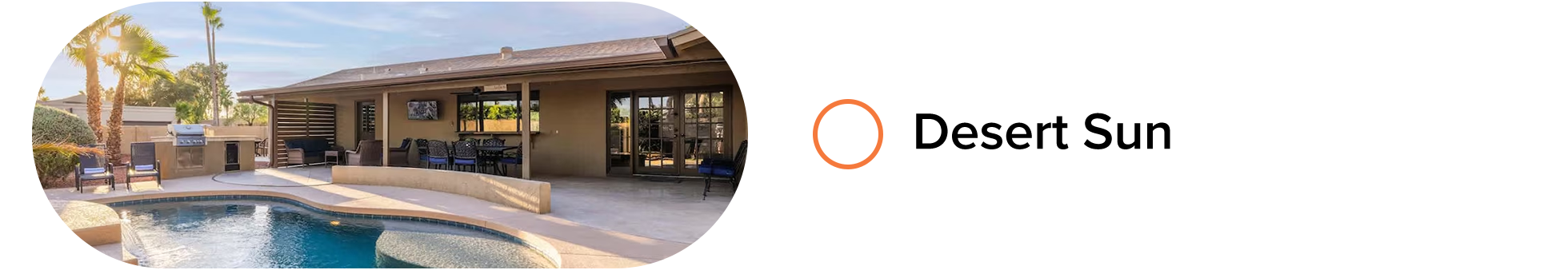 Desert-style home with curved pool, covered patio, outdoor grill, and lounge seating.