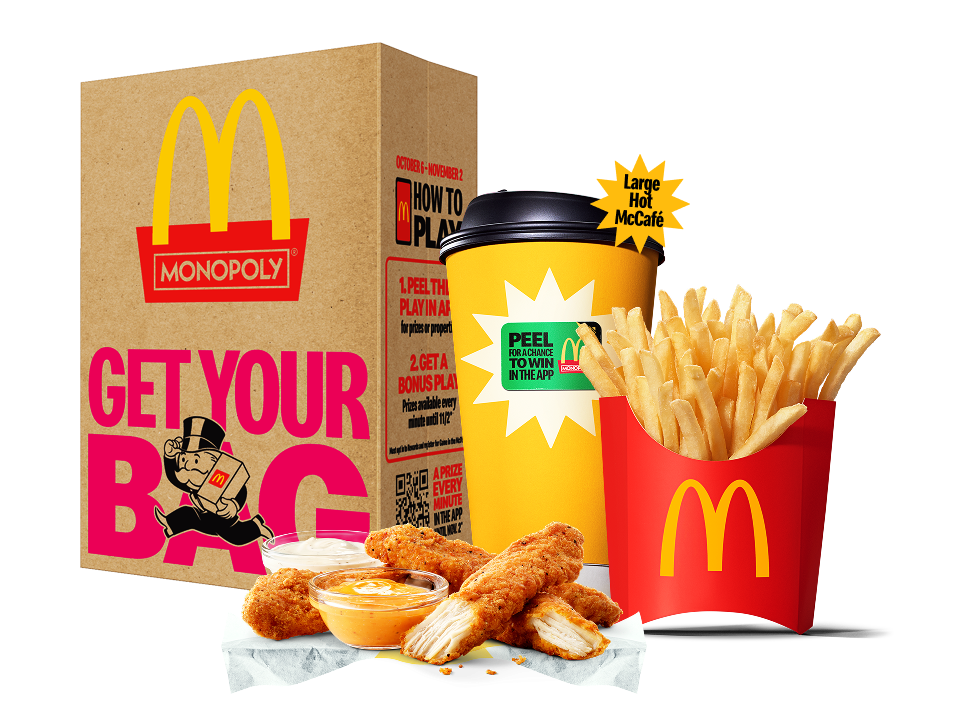 Image of 4 piece McCrispy Strips, Medium Fries, and a Large Hot McCafé in front of a McDonald’s bag.