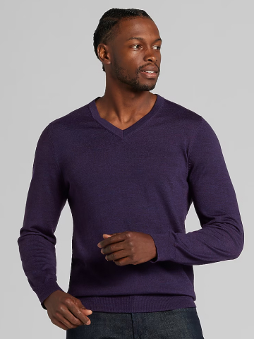 Man wearing purple V-neck merino sweater.