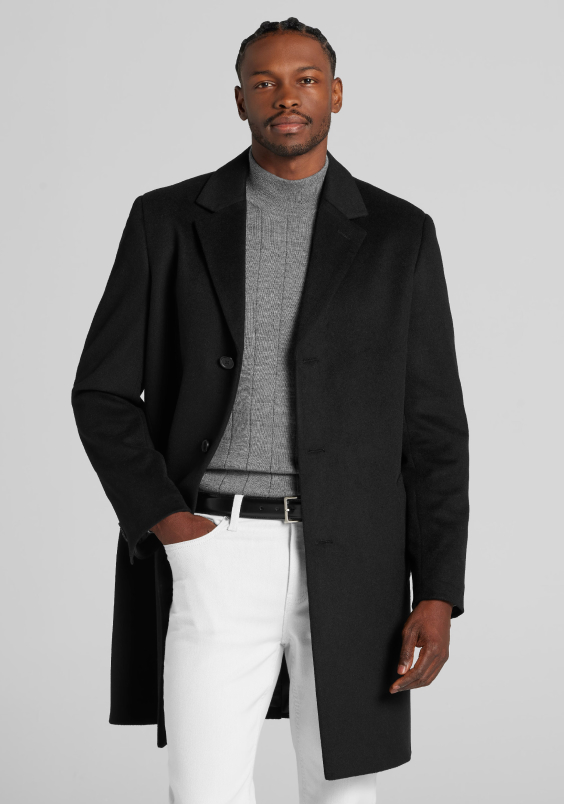 Model wearing a black coat