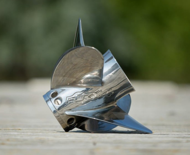 A stainless steel propeller with the word fox on it