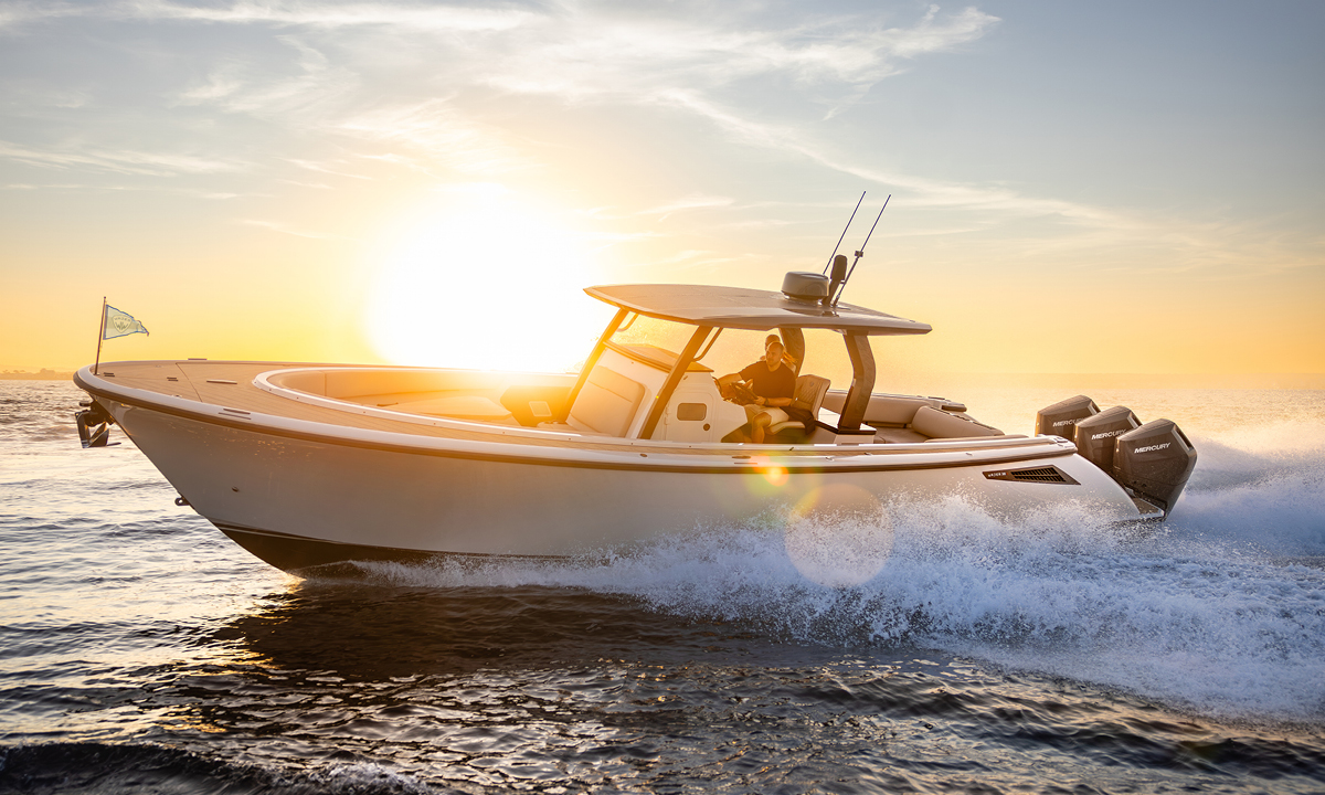 Boat with a V10 Mercury Outboard behind a sunset.