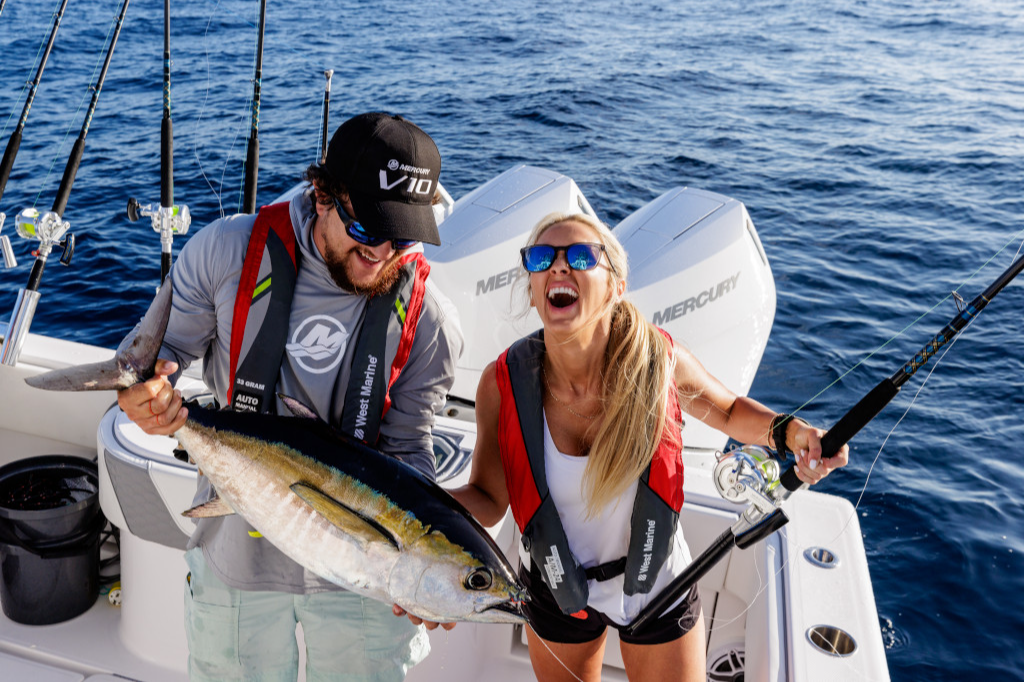 Two anglers celebrate a successful fishing trip with a sizable catch.
