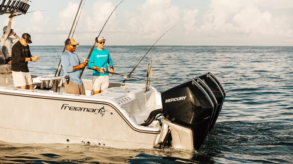 Two anglers enjoy a peaceful morning on the water in a modern fishing boat.