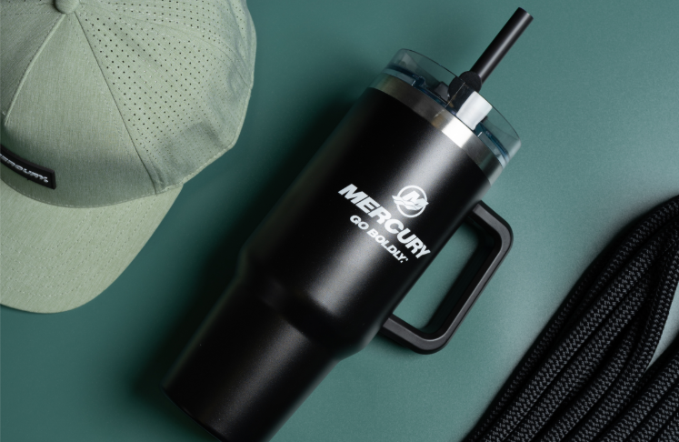 Black Mercury travel mug with handle and straw.