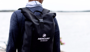 A person wearing a black Mercury backpack. Shop accessories.