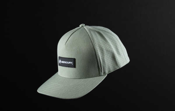 A light green Mercury baseball cap with a black patch featuring the Mercury logo.