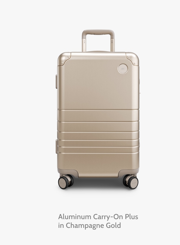 Aluminum Carry-On Plus in Champagne Gold.