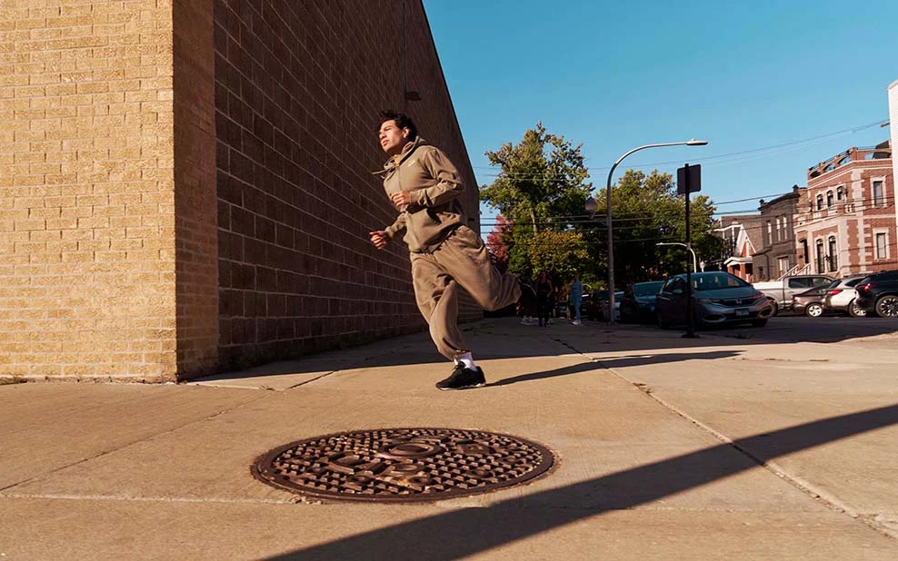 A man running around a corner outside