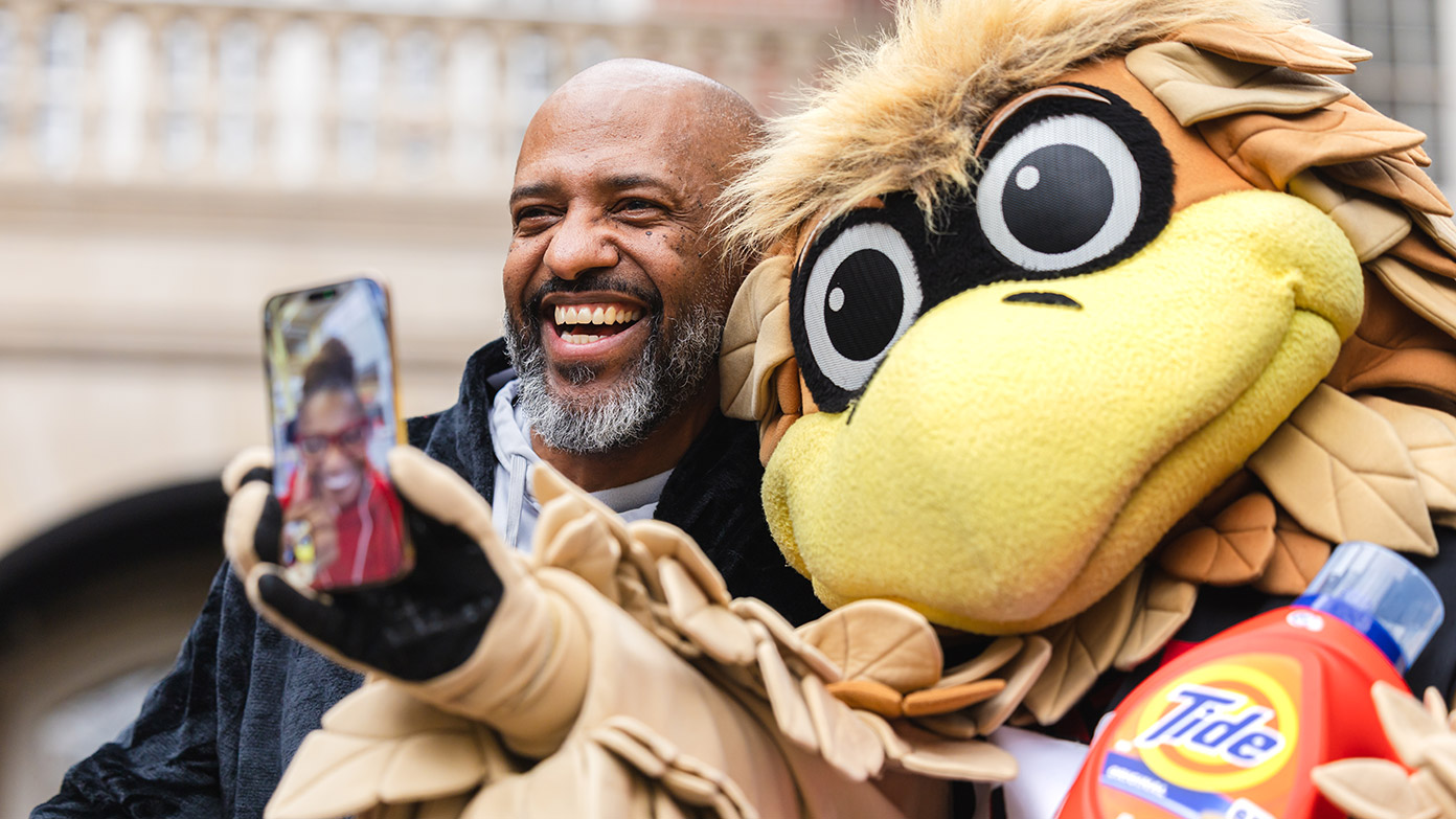 Freddie Falcon posing with a Season Ticket Member