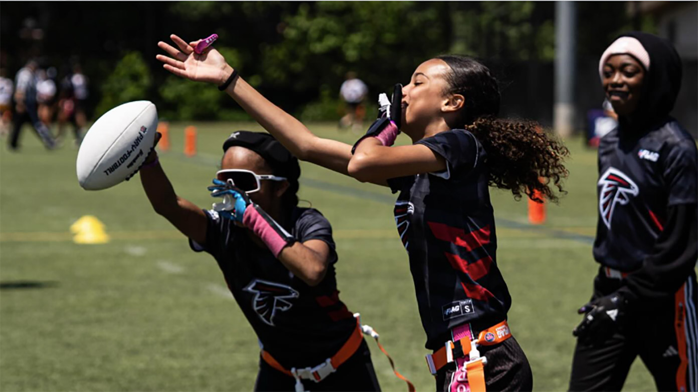 Young athletes in-action playing flag football.