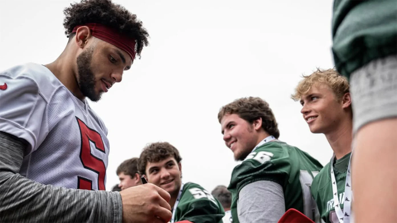 Drake London with North Hall High School athletes