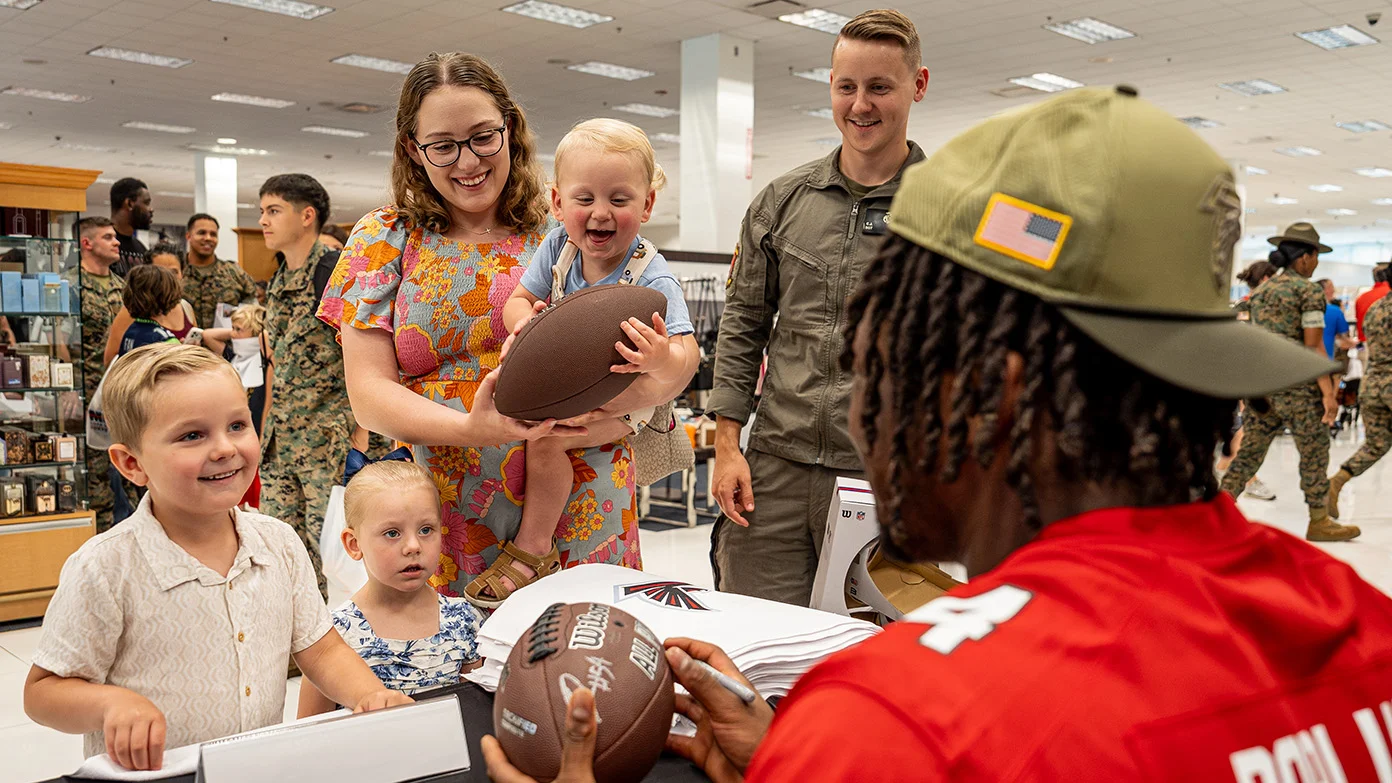 Falcons players and Legends meet military members and their families.